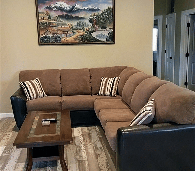 Full view of sectional which has a queen size sofa bed pull out