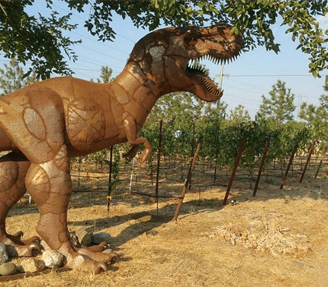 Large 12ft tall T-REX statue guarding the vineyards