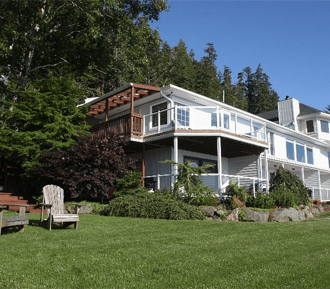 The property is nicely landscaped and has a pretty grassy yard.