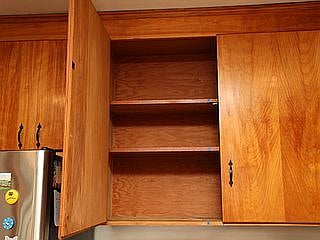 Peek inside. Everyone gets a set of shelves like these in one of the kitchen cupboards. There is drawer space for each person also. The rest of the cupboards and drawers contain items used by all in the household.