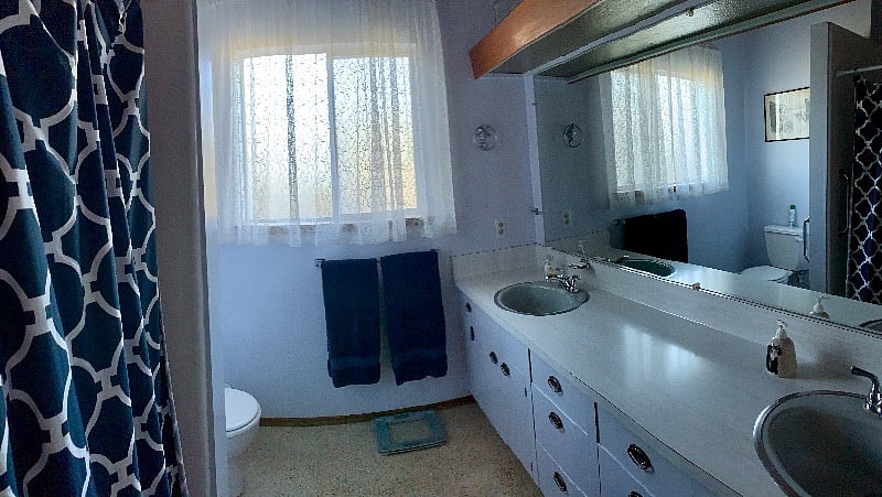 Double sink bathroom with tub/shower upstairs
