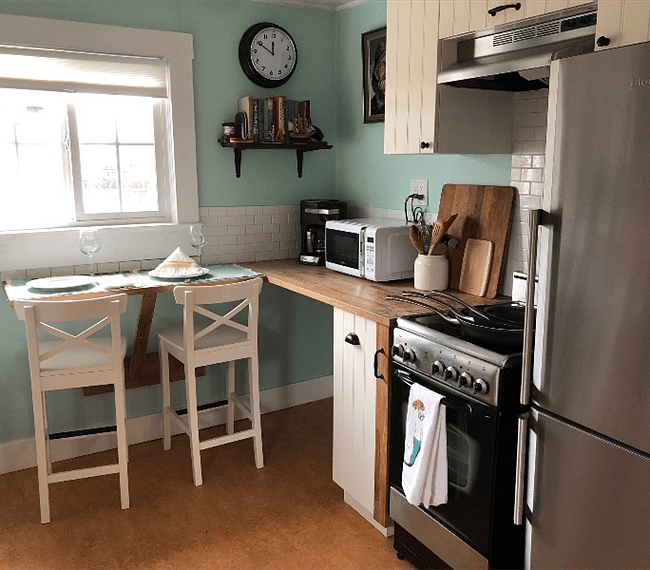 Lots of storage in kitchen above and below the wood counters. Microwave and many ways to make coffee. Also a toaster!