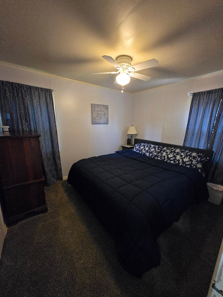 Master bedroom on the backside of the house with King Size bed and TV