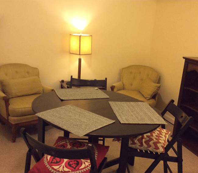 The den showing the dinning table w/ chairs, antique queen chairs