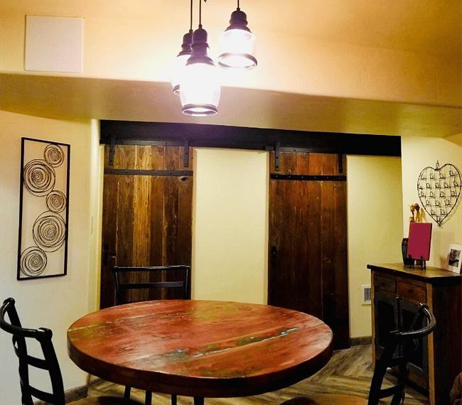 Handmade barn doors closing the bathroom and laundry room