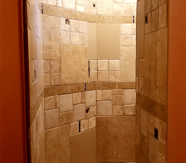 Shower tiled with stone and fossils