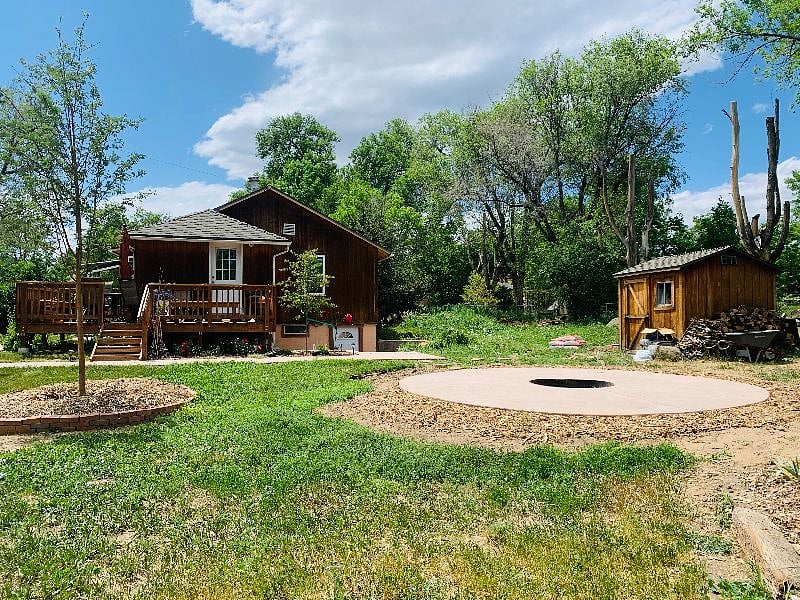 East view of communal yard space with circular fire pit patio