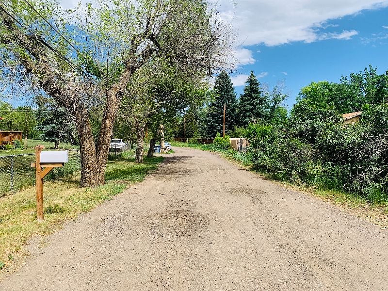Dirt road leading to driveway