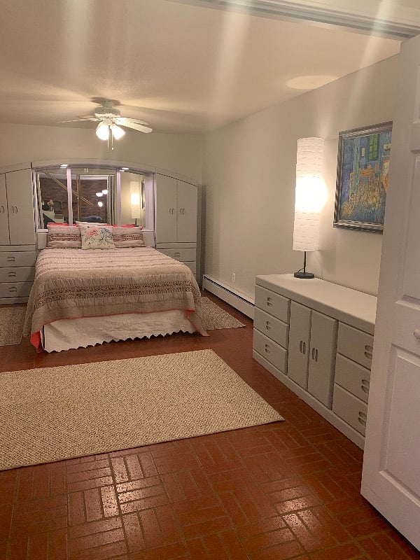 Queen Bed. With doors closed the room is completely dark for daytime sleeping. With doors open, light streams in.