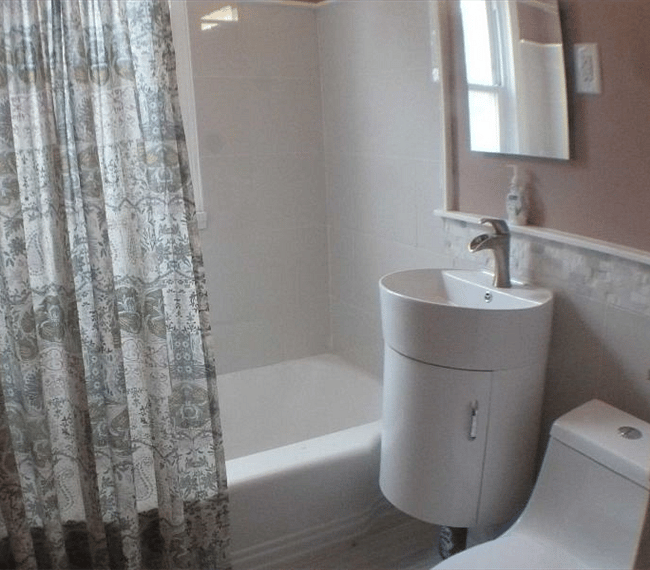 The bathrooms feature beautiful stone flooring and new fixtures.