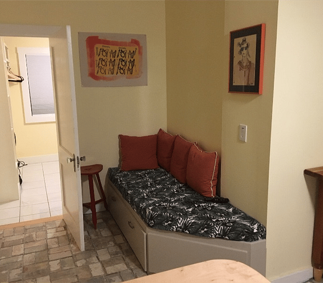 lounge with big screen tv on wall