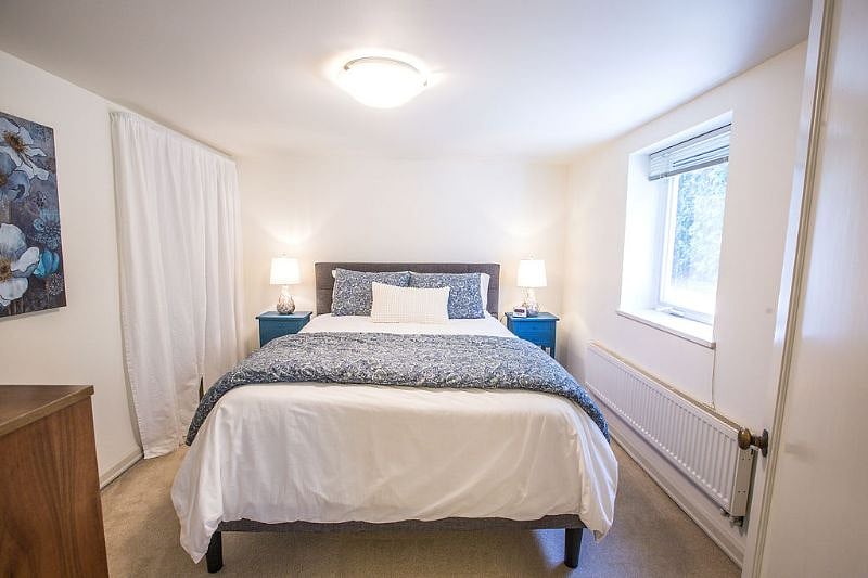 Queen size bed with foam topper, full closet, and dresser.