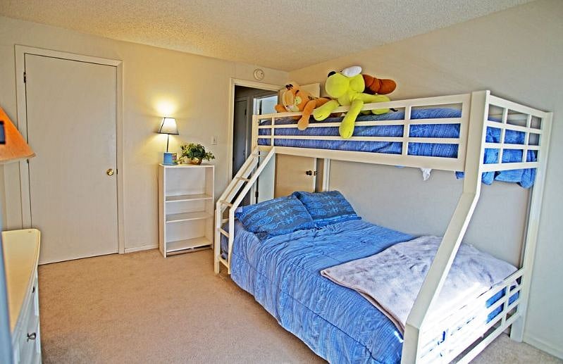 FOURTH BEDROOM WITH TWIN/FULL BUNK BED, TV AND BATHROOM NEARBY