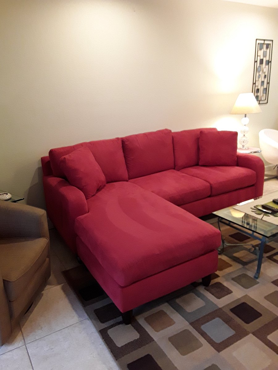 New red sofa has replaced white sofa.