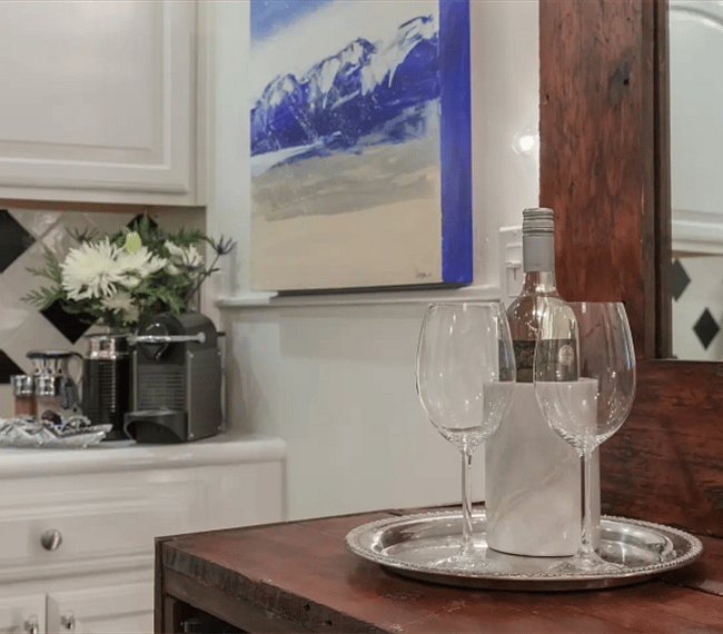 Bistro area with Nespresso machine capsules, David's Teas and complimentary bottle of wine