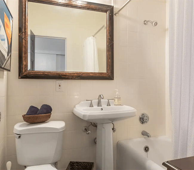 Remodeled bathroom with thick comfortable bath mats and towels. Shampoo, conditioner and body wash provided.