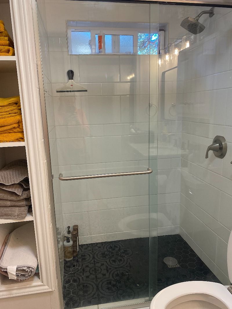 downstairs bathroom, new tile shower, floors cabinets