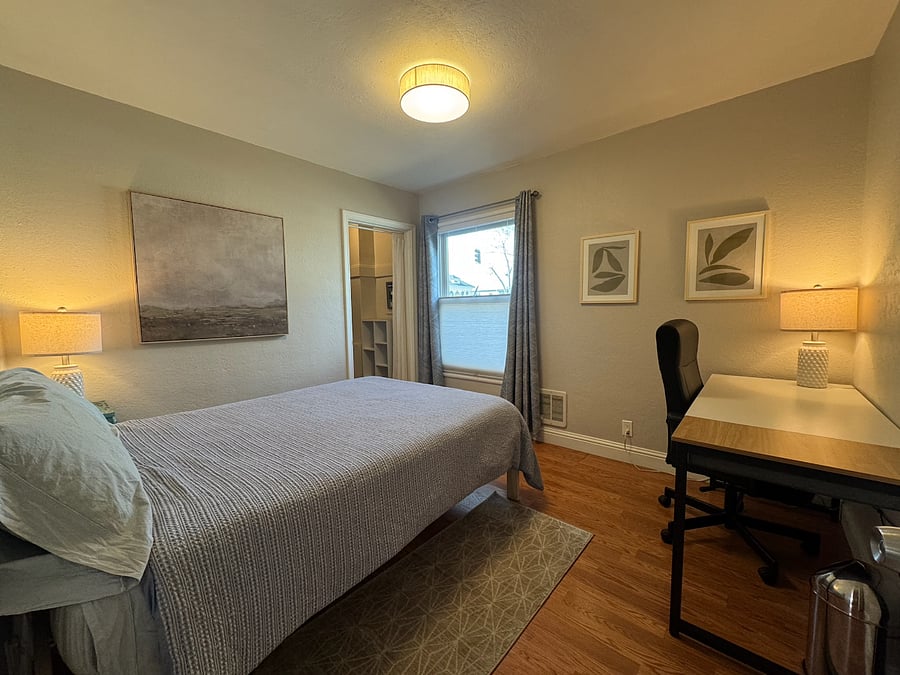 SECOND BEDROOM | Full bed, bedside table, walk-in closet with bins, desk & desk chair