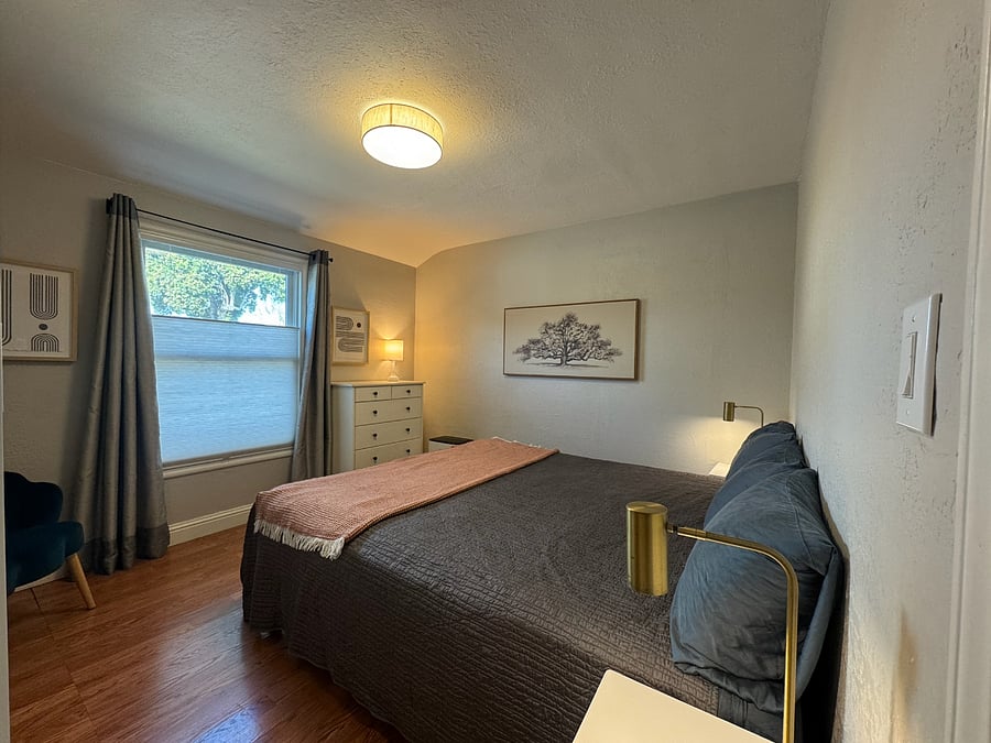 PRIMARY BEDROOM | Cal King bed, bedside tables, dresser & extra large armoire