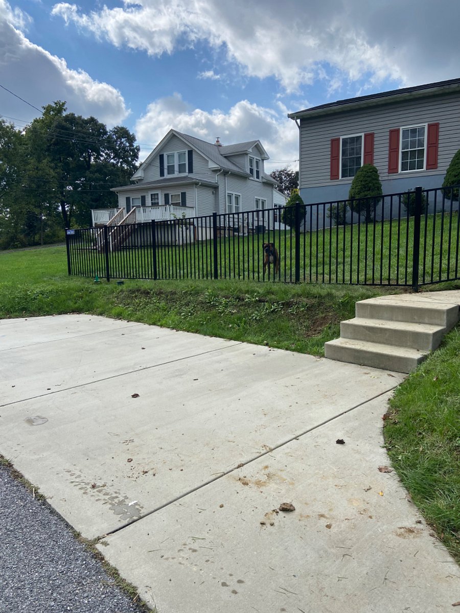 Parking pad for your convenience with fence to separate properties.