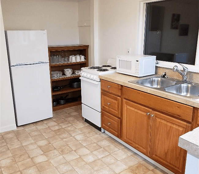 This kitchen includes 2 bars as well. One has seating for 2.