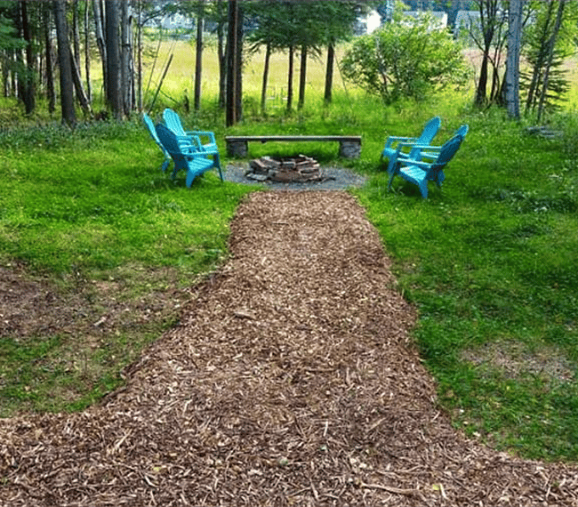 Path leading to Fire-pit from Back Deck. View of Delong Lake and Mountains from this area.