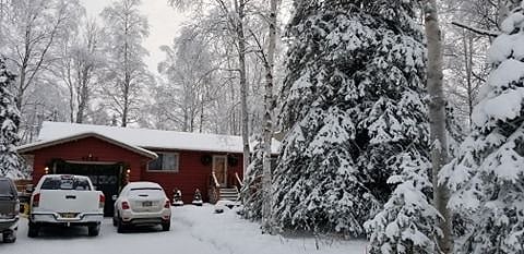 Front of House tucked away in the trees. View from Street.