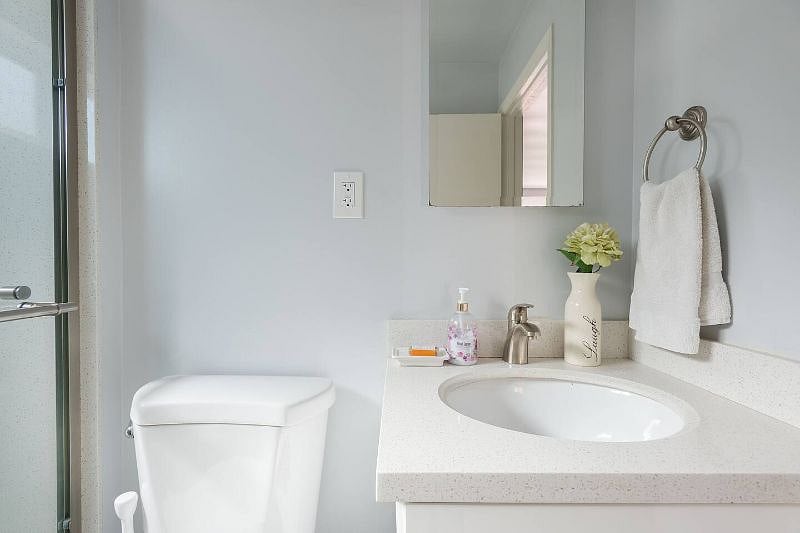 Well stocked bathroom with soap, shampoo, conditioner, hairdryer.
