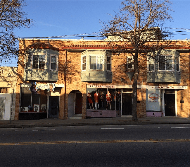 Street view of building. 2 residential, 3 commercial businesses.