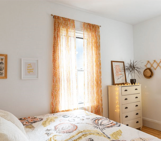 Bedroom with new queen size mattress and dresser. Closet on adjacent wall.