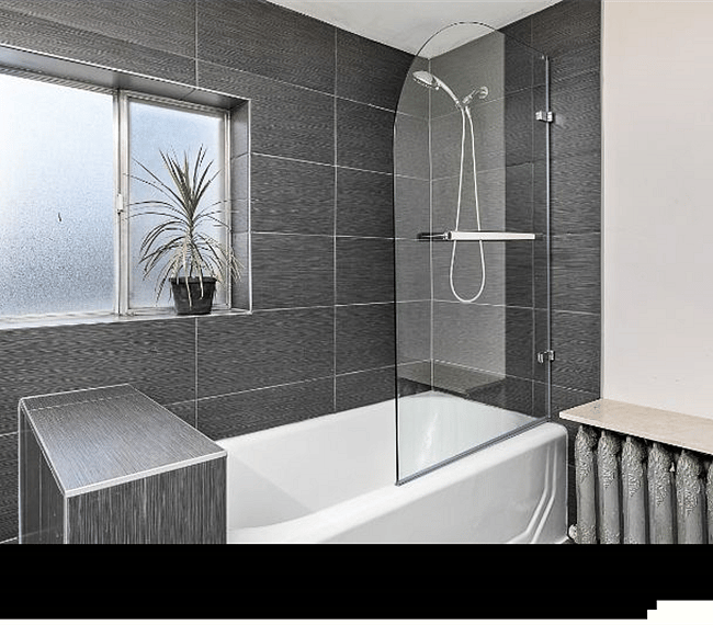 Newly tiled bath area with new shower hardware.