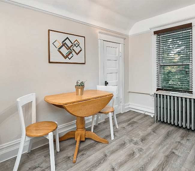 Dining area in the kitchen. Pantry door - the large pantry extends the length of the kitchen! -