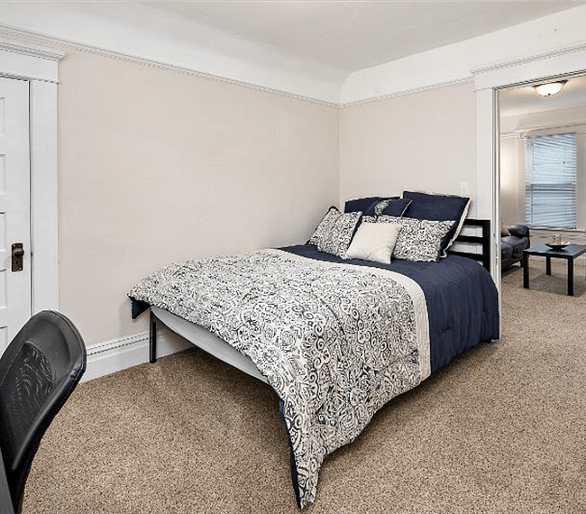 Queen size bed. Photo view from the bedroom desk alcove.