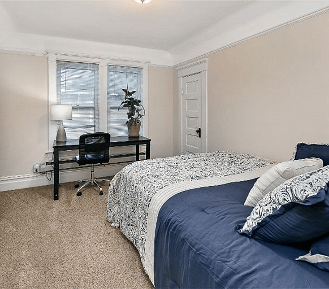 East facing windows and large bedroom closet. Walk-in closet extends the length of the room