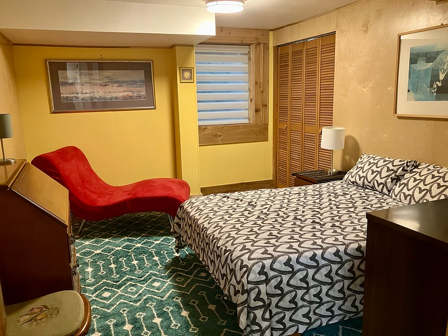 Bold and cheerful Bedroom 2 features a double bed, a luxurious lounger, a drop-down secretary style desk and ample dresser and closet space. 13'8" x 10'8"