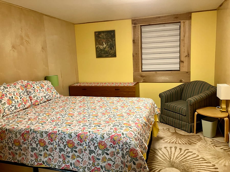 Bright and restful Bedroom 1 features a queen bed, comfy reading chair and ample dresser and closet space.
13'8" x 10'6"