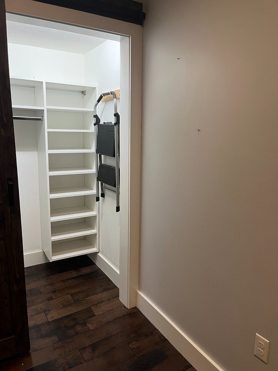 coat closet / step ladder (in dining space / front entrance) 