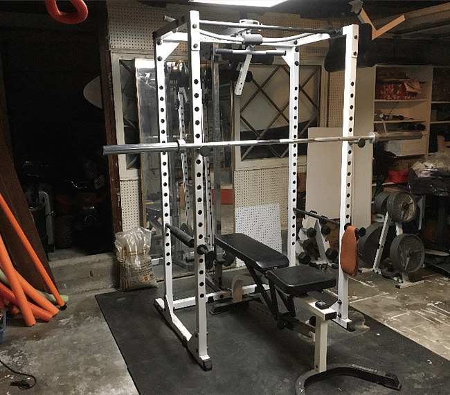 Full weight set, padded floor, multiple benches, yoga mats, dumbbells, and air conditioning.