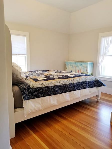 Master bedroom with closet and queen bed