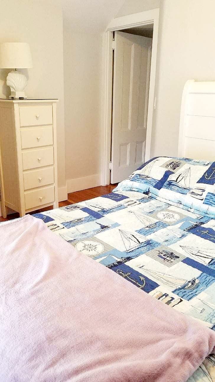 Master bedroom with closet and queen bed (view facing door to bedroom)