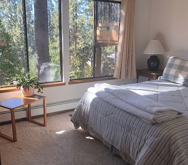 Bedroom with queen sized bed, 8 foot closet, two bedside tables and lamps. Full sized linen closet between the living and bedroom. Bathroom across the hall. 