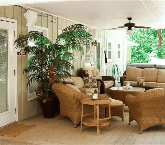 Back porch that overlooks the lake and door to apartment.