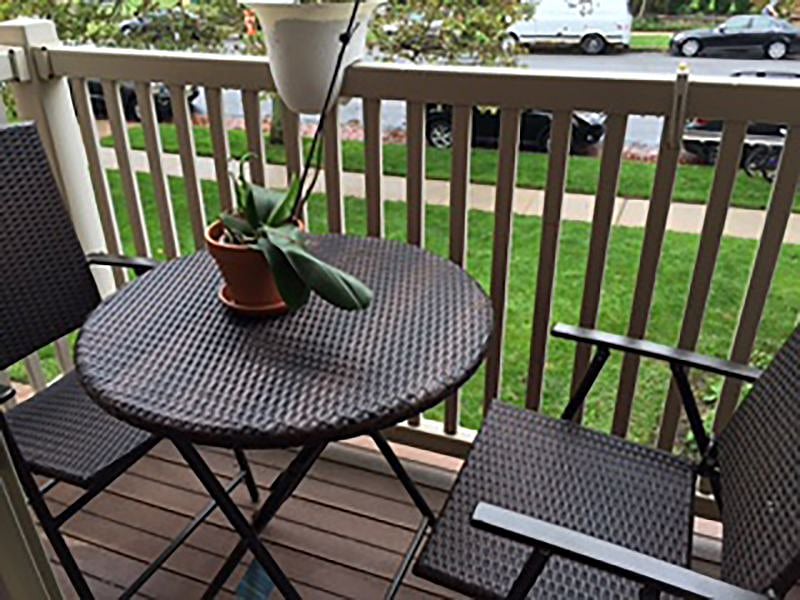 Enjoy a cup of coffee or a glass of wine on this Juliet balcony overlooking the front garden of the condo building.
