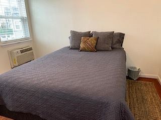 Bedroom with Queen-sized bed and space on both sides of bed and at foot of bed. AC unit included. Windowed. A nightstand has been added as well as a dresser drawer. I maintain a locked owner's closet in the bedroom that is off-limits to tenant.