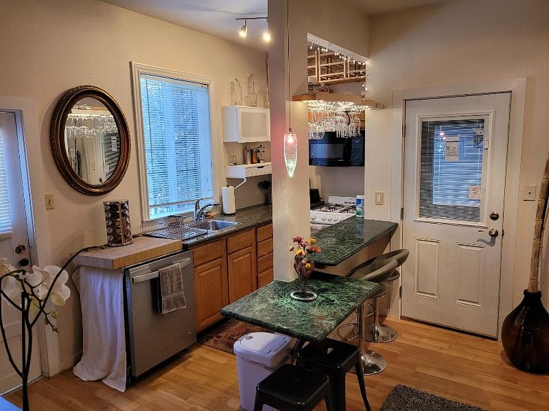 kitchen, including cooker, microwave, dishwasher and other appliances