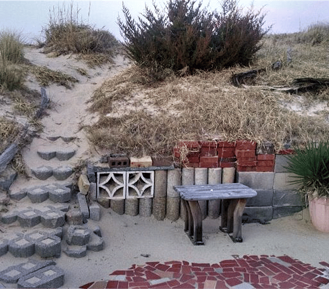 Back Patio and steps over dune to beach.
