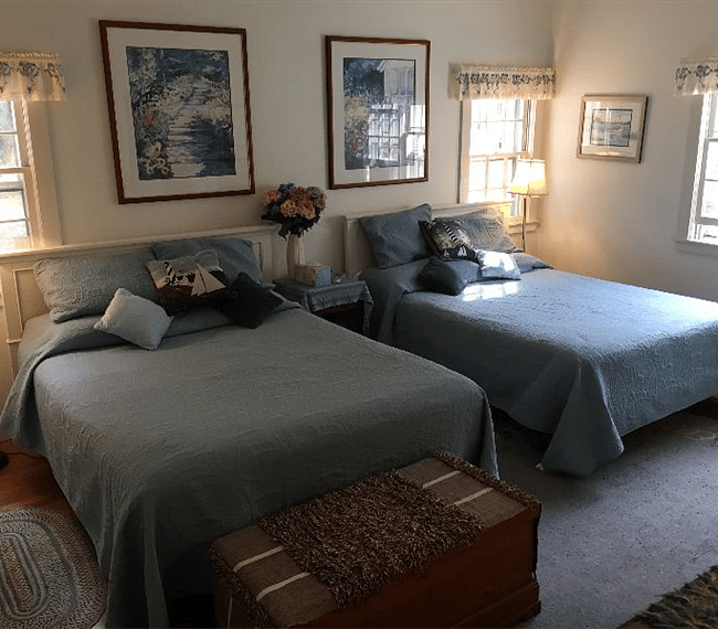 Master bedroom with two Queen beds on ground floor.  Master bathroom is attached.