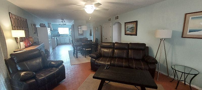 New reclining chair and sofa for the TV area. In the back : The dinning area that can accommodate 4 to 8 people.