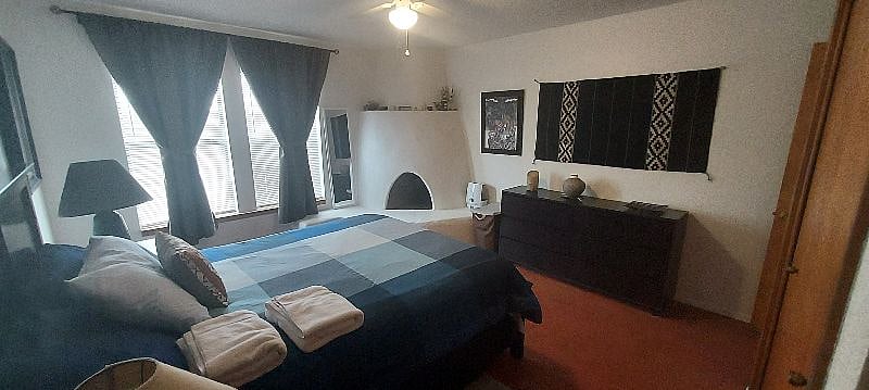 MASTER BEDROOM. With Kiva Fireplace purely decorative since it is not allowed to lighten it. Ample storage for your clothes and a large closet.