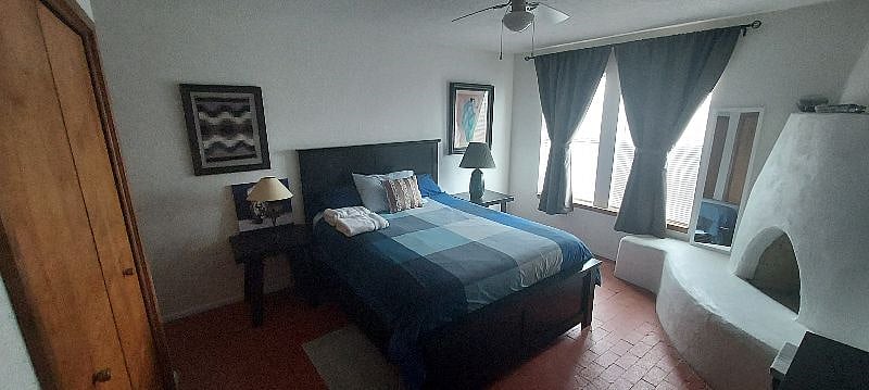 MASTER BEDROOM. Very comfortable queen size bed with darkening curtains and excellent mattress.